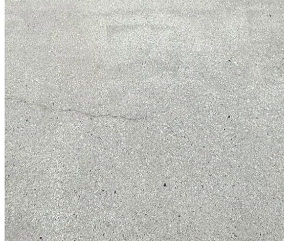 Clean bright concrete driveway after professional pressure washing in Cary NC